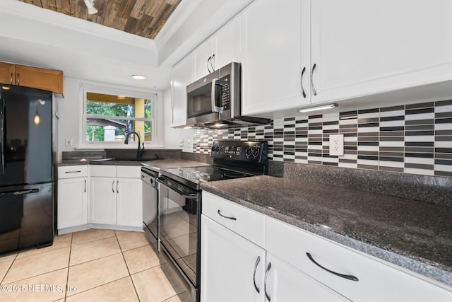 765 Sea Oats Bay, Ponte Vedra Beach, FL 32082 - kitchen with a sink, white cabinets, light tile patterned flooring, and black appliances