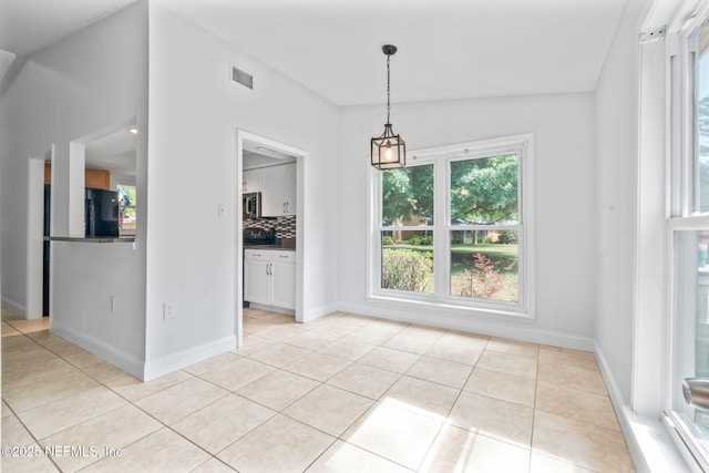 765 Sea Oats Bay, Ponte Vedra Beach, FL 32082 - unfurnished dining area with light tile patterned flooring, baseboards, and visible vents