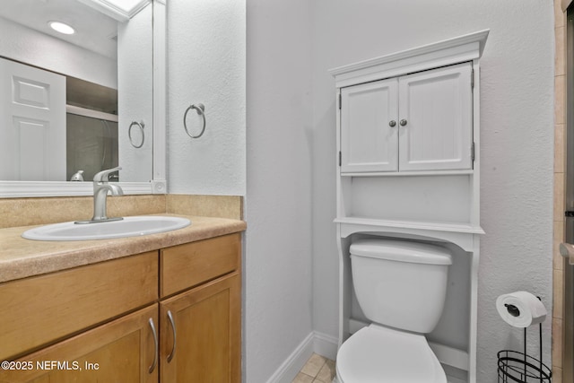765 Sea Oats Bay, Ponte Vedra Beach, FL 32082 - full bath with tile patterned flooring, a shower with shower door, baseboards, vanity, and toilet