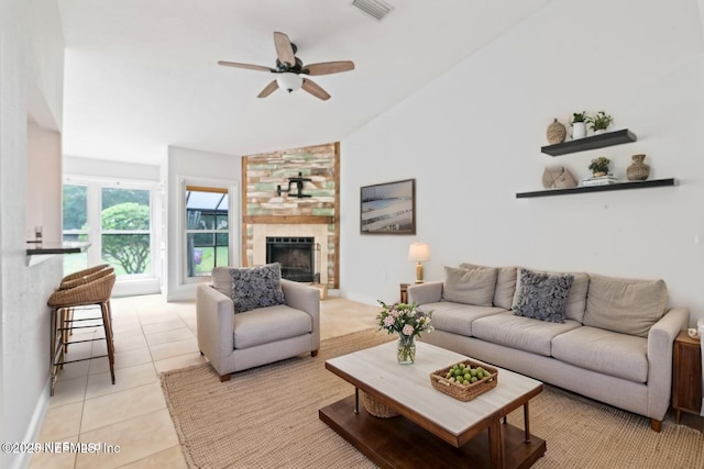 765 Sea Oats Bay, Ponte Vedra Beach, FL 32082 - living room with ceiling fan, visible vents, a fireplace, vaulted ceiling, and light tile patterned floors