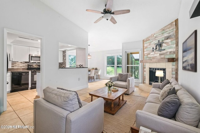 765 Sea Oats Bay, Ponte Vedra Beach, FL 32082 - living room with lofted ceiling, light tile patterned flooring, a fireplace, baseboards, and a ceiling fan
