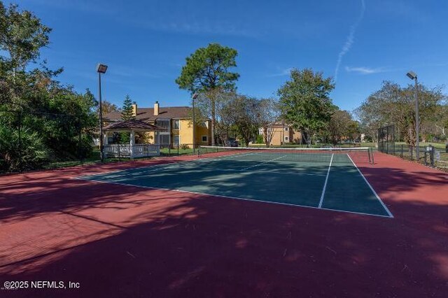 765 Sea Oats Bay, Ponte Vedra Beach, FL 32082 - view of tennis court featuring fence