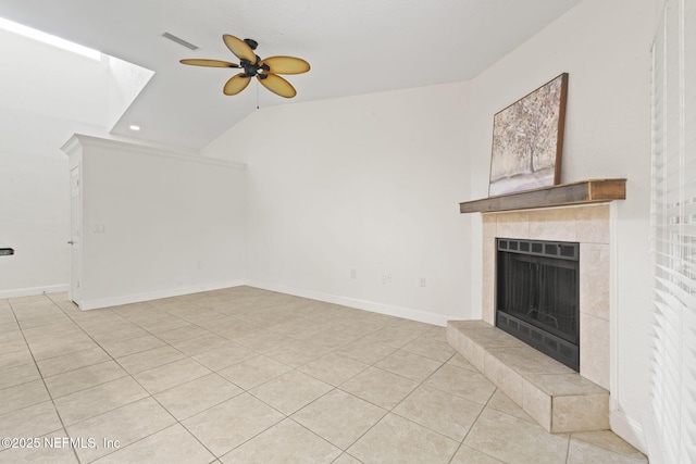 810 Sandpiper Ln, Ponte Vedra Beach, FL 32082 - unfurnished living room featuring a ceiling fan, visible vents, vaulted ceiling, a tile fireplace, and light tile patterned flooring