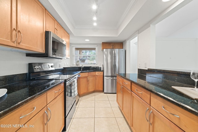 810 Sandpiper Ln, Ponte Vedra Beach, FL 32082 - kitchen with a sink, a raised ceiling, dark stone countertops, stainless steel appliances, and light tile patterned floors