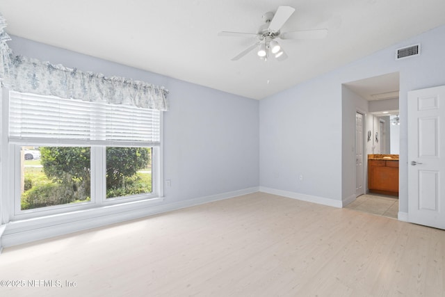 810 Sandpiper Ln, Ponte Vedra Beach, FL 32082 - unfurnished bedroom with ensuite bath, light wood-style flooring, baseboards, lofted ceiling, and visible vents