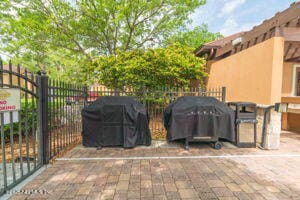 810 Sandpiper Ln, Ponte Vedra Beach, FL 32082 - view of patio with grilling area and fence