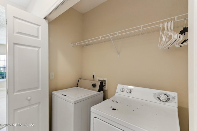 washroom with washer and dryer and laundry area