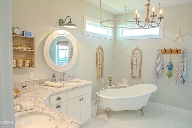 bathroom with double vanity, a soaking tub, marble finish floor, and a sink