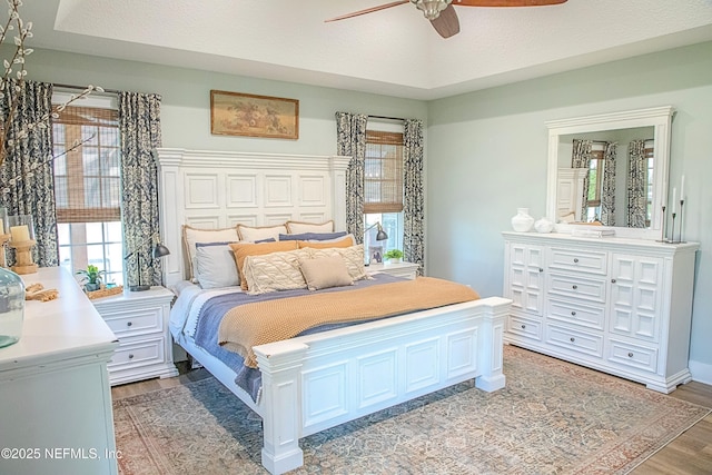 bedroom featuring light wood finished floors and ceiling fan