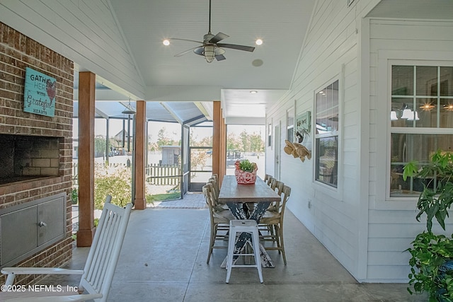 sunroom / solarium featuring a ceiling fan
