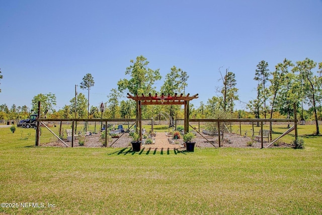 view of playground featuring a lawn and a garden