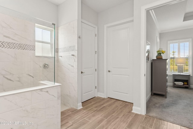 full bathroom featuring a walk in shower, ornamental molding, baseboards, and wood finish floors