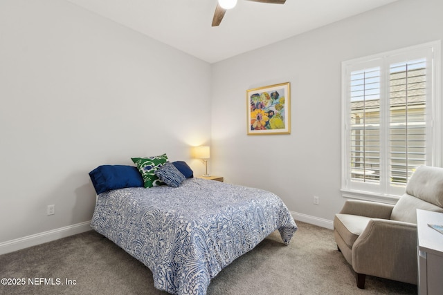 carpeted bedroom with a ceiling fan and baseboards