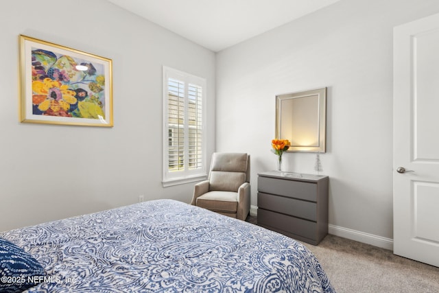 carpeted bedroom with baseboards