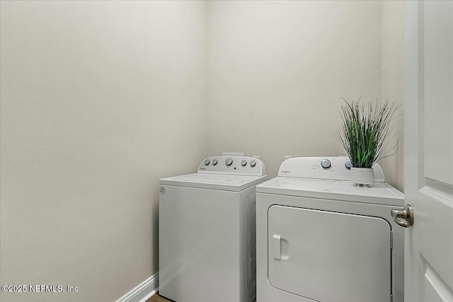 laundry room featuring laundry area and washing machine and clothes dryer
