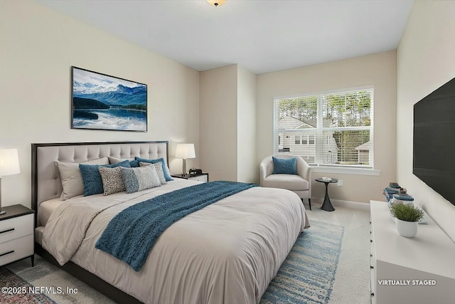 bedroom featuring carpet flooring and baseboards