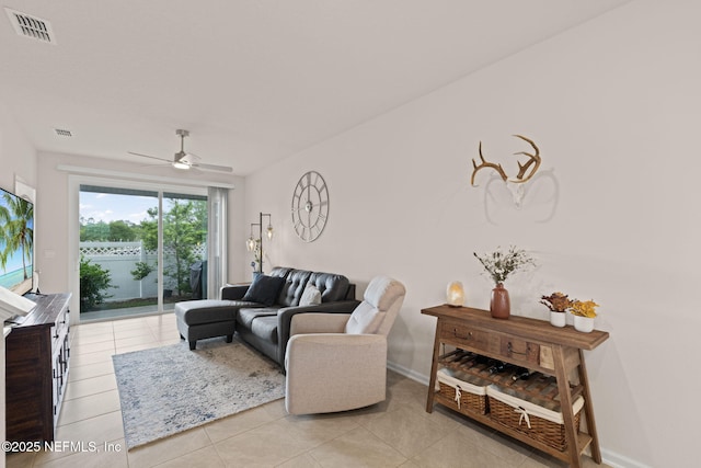 3937 Oak Mill Rd, Orange Park, FL 32065 - living room with visible vents, ceiling fan, baseboards, and light tile patterned flooring
