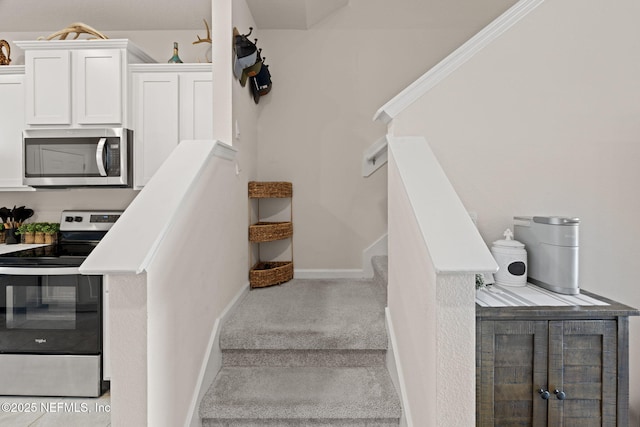 3937 Oak Mill Rd, Orange Park, FL 32065 - stairs featuring baseboards and carpet floors