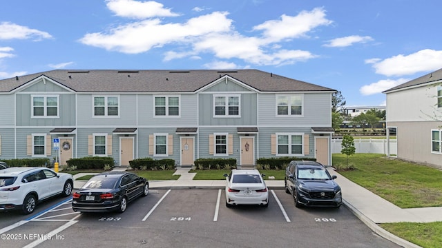 3937 Oak Mill Rd, Orange Park, FL 32065 - multi unit property featuring uncovered parking, a front yard, and fence