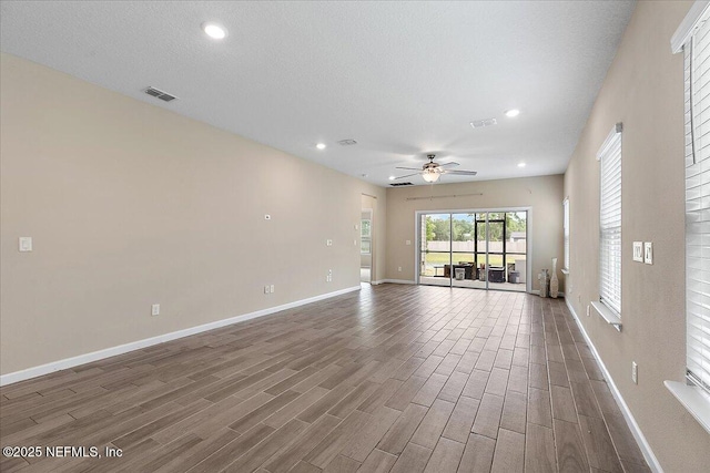 2176 Major Oak St, Jacksonville, FL 32218 - unfurnished room with recessed lighting, ceiling fan, visible vents, baseboards, and wood finished floors