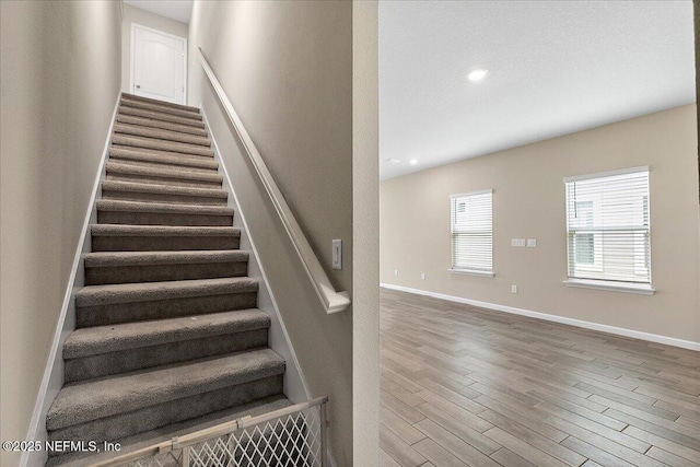 2176 Major Oak St, Jacksonville, FL 32218 - stairway featuring baseboards, recessed lighting, and wood finished floors