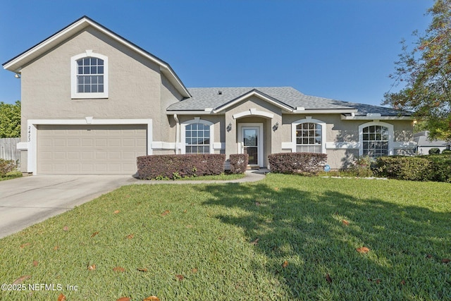 2423 Royal Pointe Dr, Green Cove Springs, FL 32043 - view of front facade featuring stucco siding, driveway, a front lawn, a garage, and a shingled roof