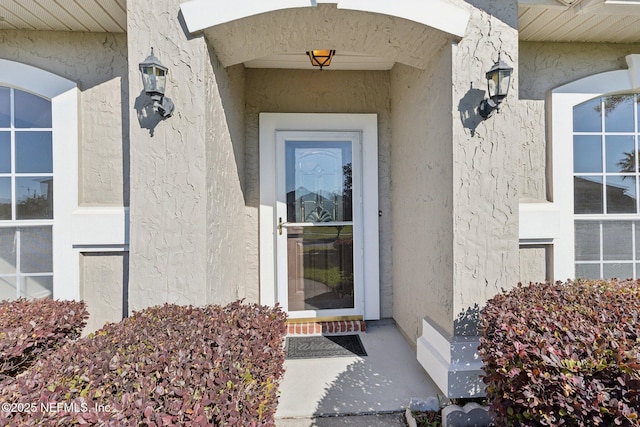 2423 Royal Pointe Dr, Green Cove Springs, FL 32043 - doorway to property with stucco siding