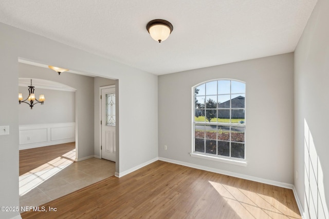 2423 Royal Pointe Dr, Green Cove Springs, FL 32043 - empty room featuring a chandelier and wood finished floors