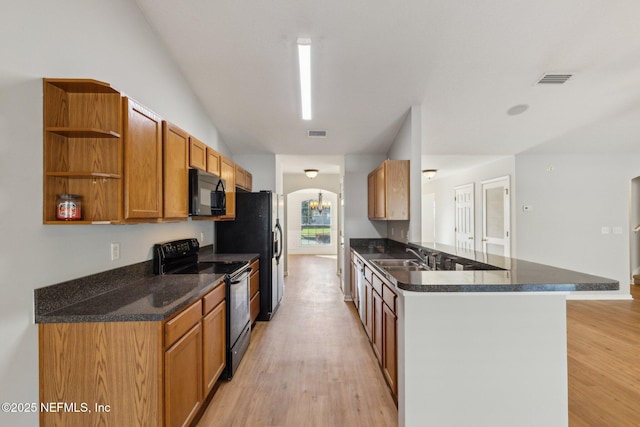 2423 Royal Pointe Dr, Green Cove Springs, FL 32043 - kitchen with a peninsula, light wood-style flooring, open shelves, black appliances, and a sink