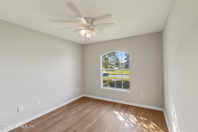 2423 Royal Pointe Dr, Green Cove Springs, FL 32043 - empty room with baseboards, a ceiling fan, and wood finished floors