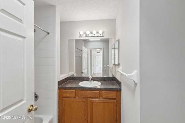 2423 Royal Pointe Dr, Green Cove Springs, FL 32043 - bathroom featuring vanity, shower / tub combination, and a textured ceiling