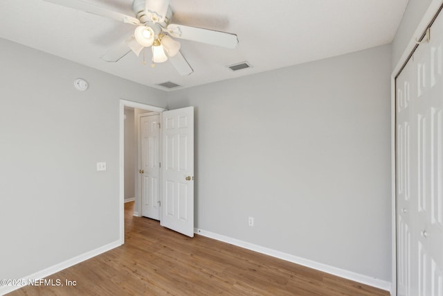 2423 Royal Pointe Dr, Green Cove Springs, FL 32043 - unfurnished bedroom with light wood-type flooring, visible vents, a closet, and baseboards