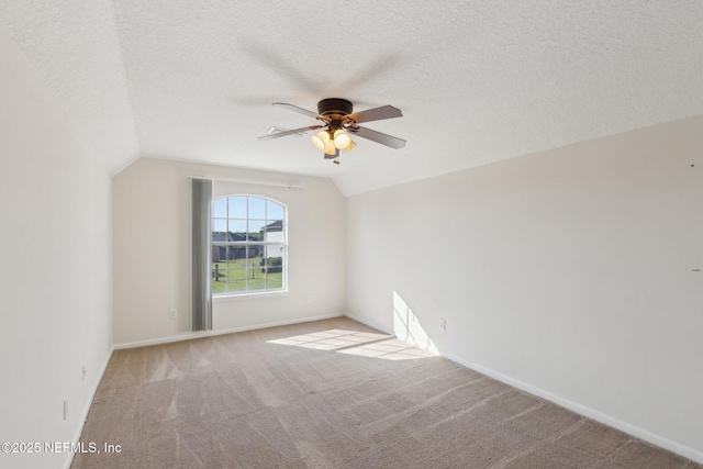 2423 Royal Pointe Dr, Green Cove Springs, FL 32043 - unfurnished room featuring light carpet, ceiling fan, baseboards, and vaulted ceiling