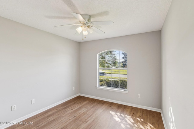 2423 Royal Pointe Dr, Green Cove Springs, FL 32043 - spare room with ceiling fan, baseboards, and wood finished floors