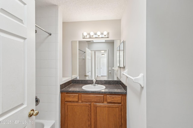 2423 Royal Pointe Dr, Green Cove Springs, FL 32043 - bathroom featuring shower / tub combination, vanity, and a textured ceiling