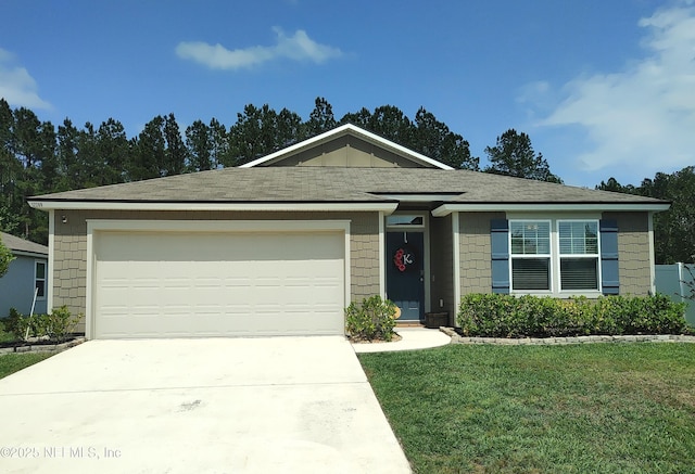 single story home with an attached garage, driveway, and a front lawn