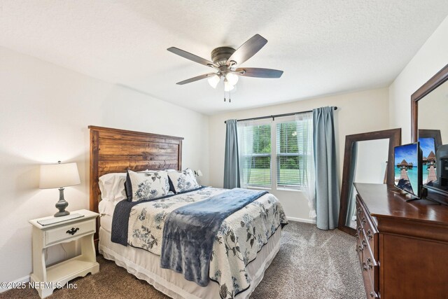 carpeted bedroom featuring baseboards and a ceiling fan