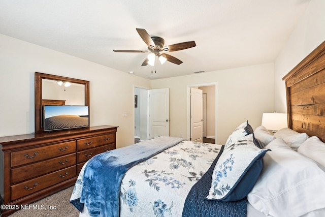 bedroom featuring visible vents, carpet, and ceiling fan