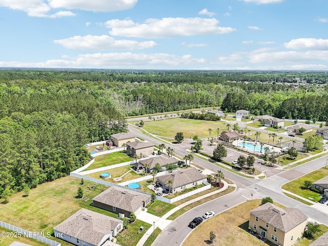 bird's eye view featuring a forest view