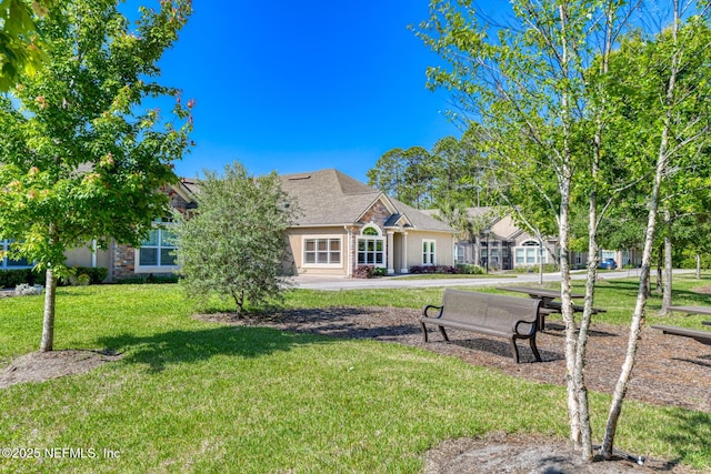 86 Amacano Ln, Saint Augustine, FL 32084 - view of front of home with stucco siding and a front lawn