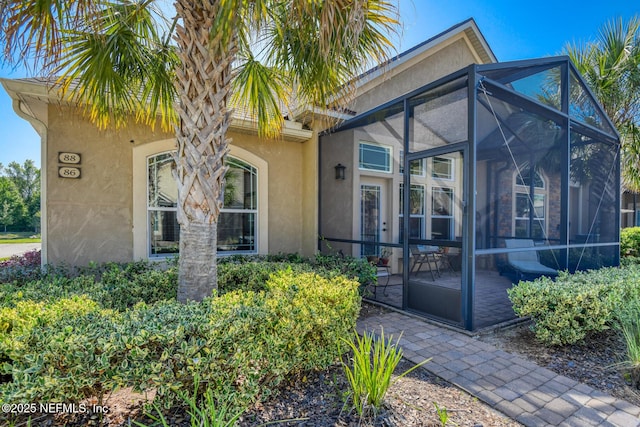 86 Amacano Ln, Saint Augustine, FL 32084 - doorway to property featuring stucco siding