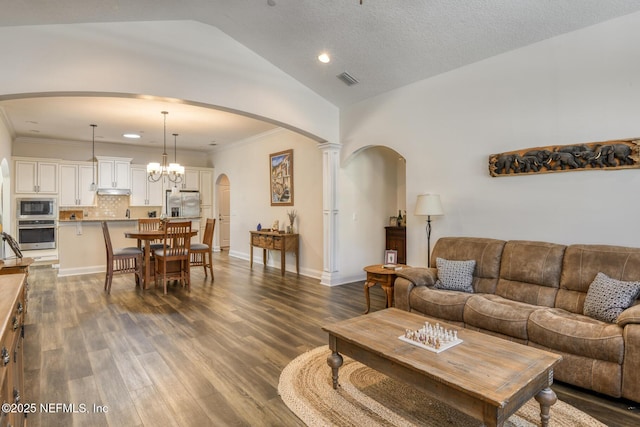 86 Amacano Ln, Saint Augustine, FL 32084 - living area featuring dark wood-type flooring, recessed lighting, arched walkways, and lofted ceiling