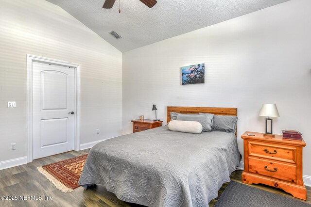 86 Amacano Ln, Saint Augustine, FL 32084 - bedroom featuring a textured ceiling, visible vents, wood finished floors, lofted ceiling, and baseboards
