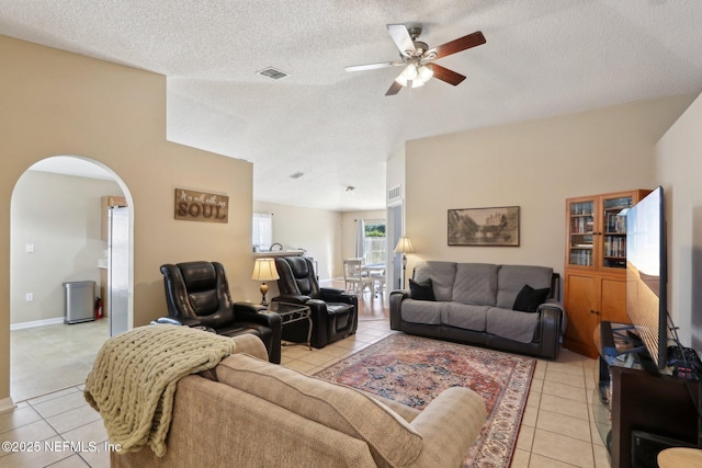 3620 Braeden Ct, Middleburg, FL 32068 - living room featuring ceiling fan, arched walkways, and light tile patterned flooring