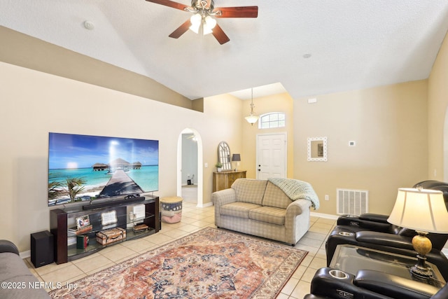 3620 Braeden Ct, Middleburg, FL 32068 - living area with a ceiling fan, light tile patterned flooring, visible vents, lofted ceiling, and arched walkways