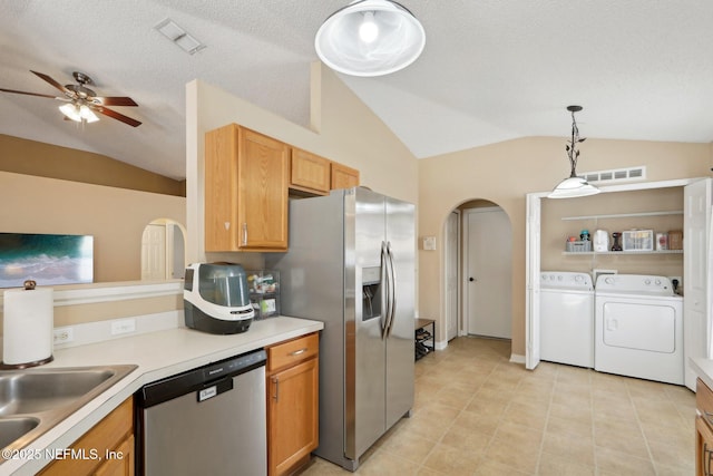 3620 Braeden Ct, Middleburg, FL 32068 - kitchen with ceiling fan, independent washer and dryer, arched walkways, appliances with stainless steel finishes, and lofted ceiling