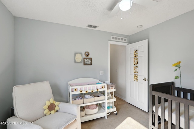 3620 Braeden Ct, Middleburg, FL 32068 - carpeted bedroom featuring ceiling fan, visible vents, and a crib