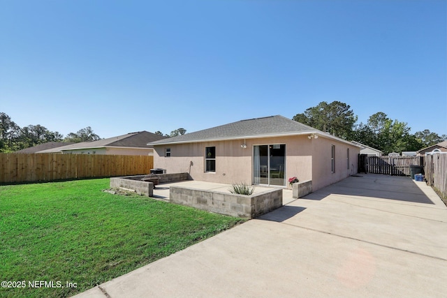 3620 Braeden Ct, Middleburg, FL 32068 - back of house featuring a patio, stucco siding, driveway, a fenced backyard, and a yard