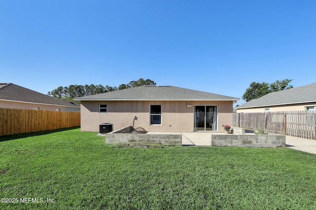 3620 Braeden Ct, Middleburg, FL 32068 - back of property with a patio area, a fenced backyard, central AC, and a lawn