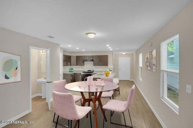 7609 Eaton Ave, Jacksonville, FL 32211 - dining room with baseboards, light wood-type flooring, and recessed lighting